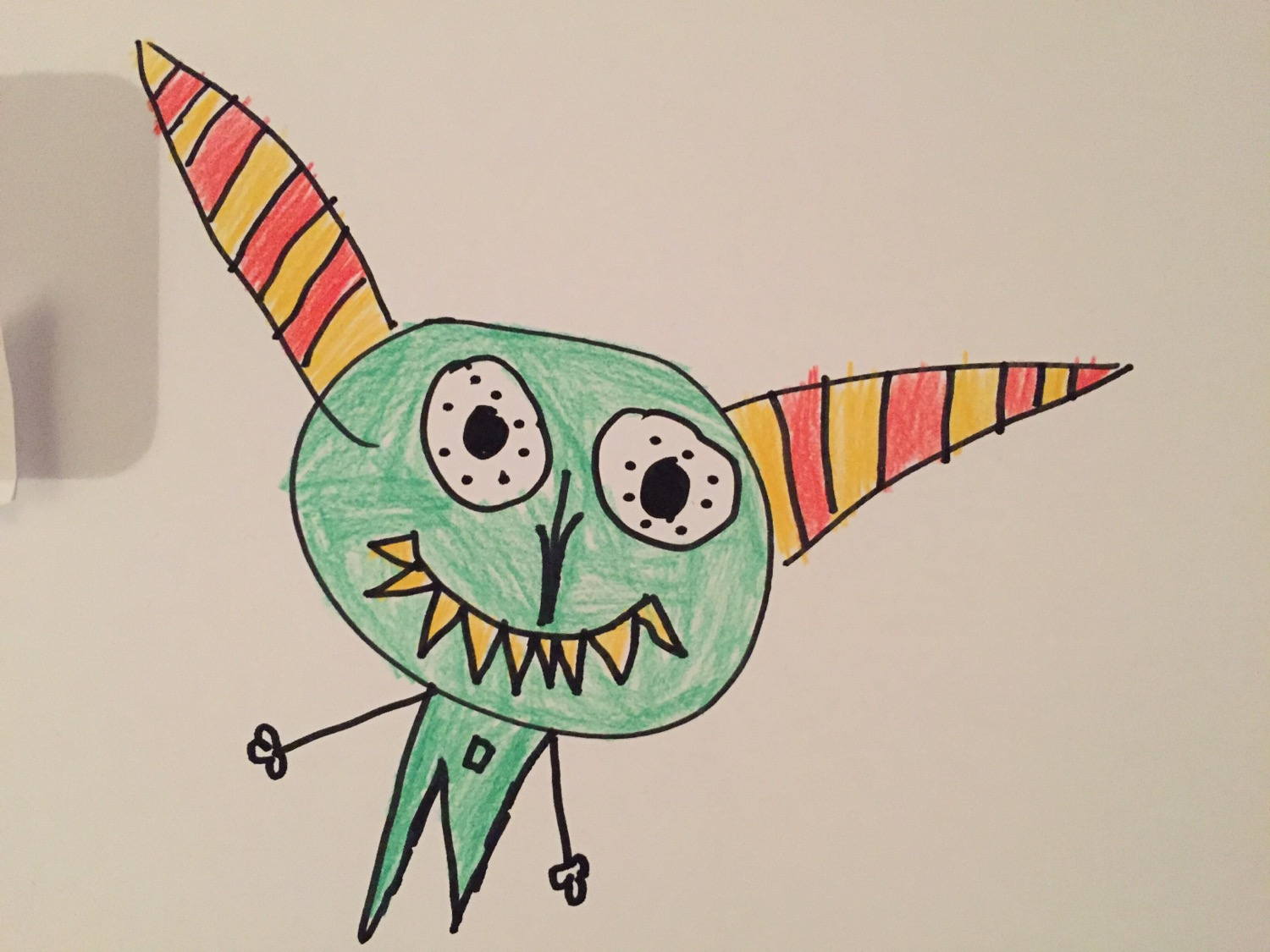 A monster drawn by my daughter today. The first time she used an alternating color pattern.
