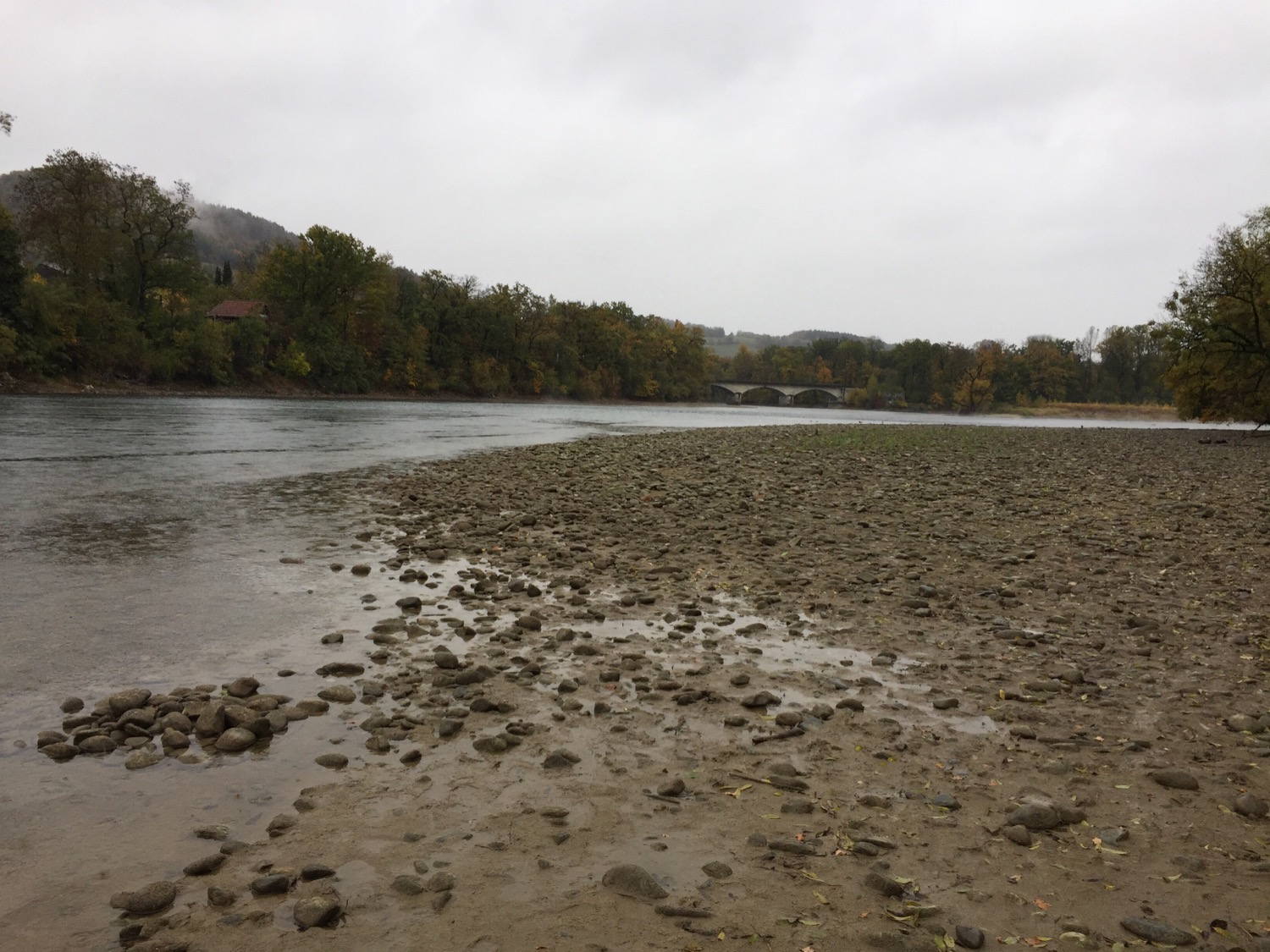 A rainy hike next to a river.
