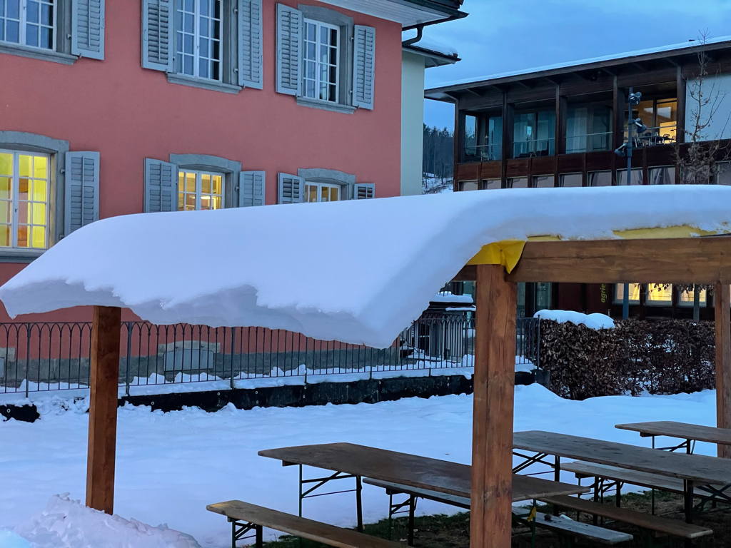 Snow hanging from the roof.
