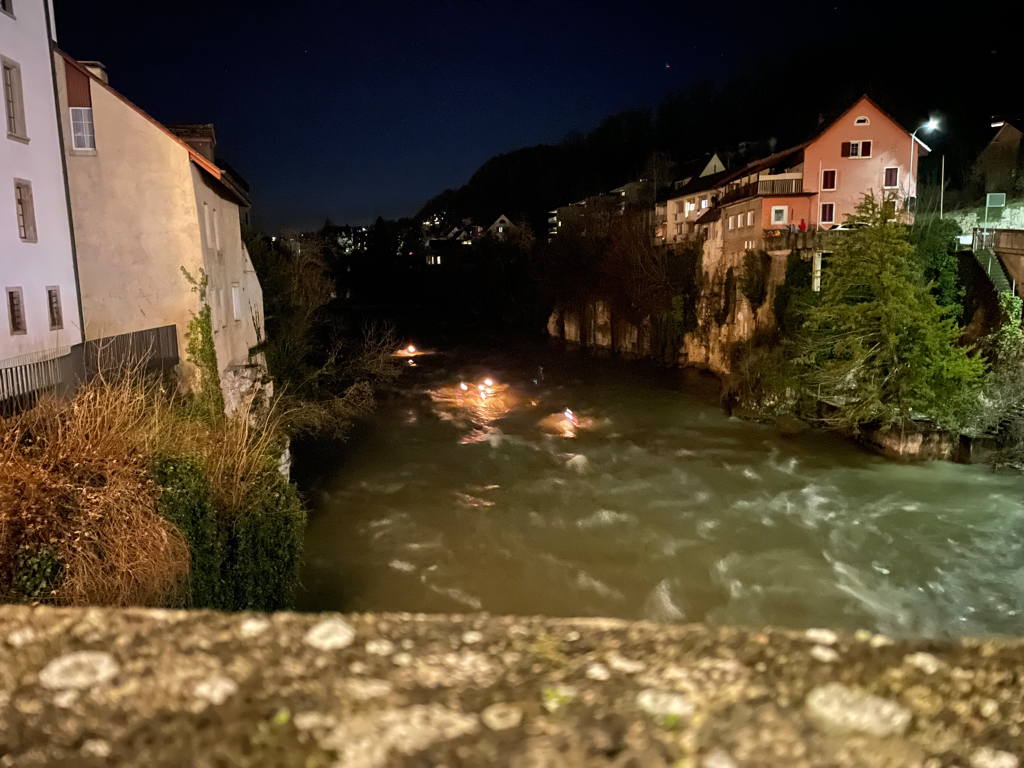Watching the local rescue swimmer brigade swimming down the river with torches in their hands.
