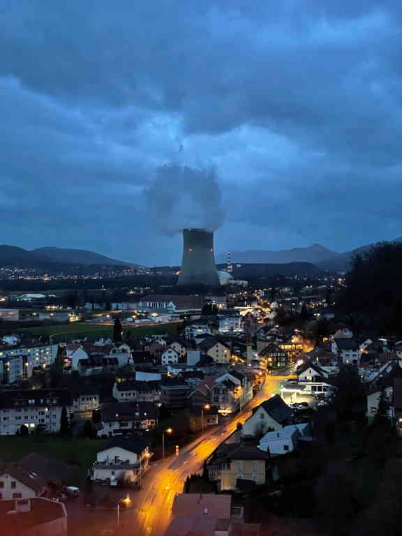 On the top of the church tower, I was looking at the cooling tower of the nearby nuclear power plant. Where part of the power comes from powering my devices at home. In between, we see the city and a street with cars. I like how the long exposure time streaked the car&rsquo;s lights.
