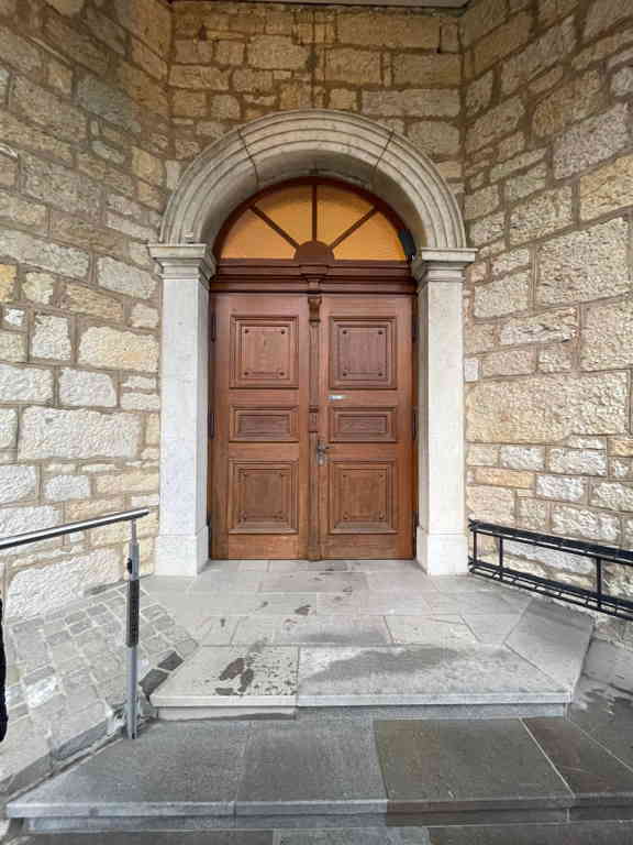 The church door (see the last image).
I don’t have pictures from the inside, but I love the contrast of the outside with the raw stone look, and the interior has a surprisingly light and colorful color scheme.
