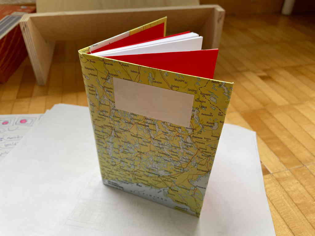 I finished my second bookbinding project some days ago. I&rsquo;m happy with the outcome – I especially like the old map I used for the cover decorations.
The book is A6 in size and was bound, not only glued like my first one. The decorative paper on the cover insides are red.
