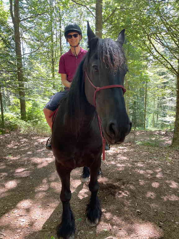 Close up of myself on top of an horse. Picture was taken inside the forest.
