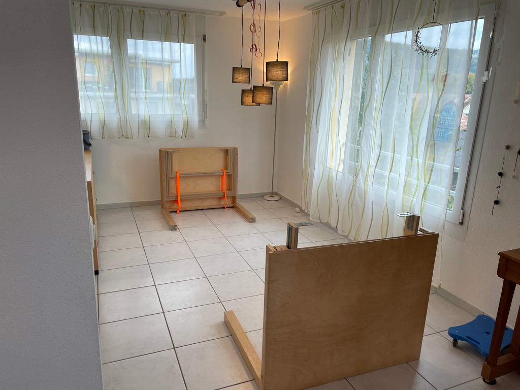 Photo of our dining area with the table disassembled into the two main parts.