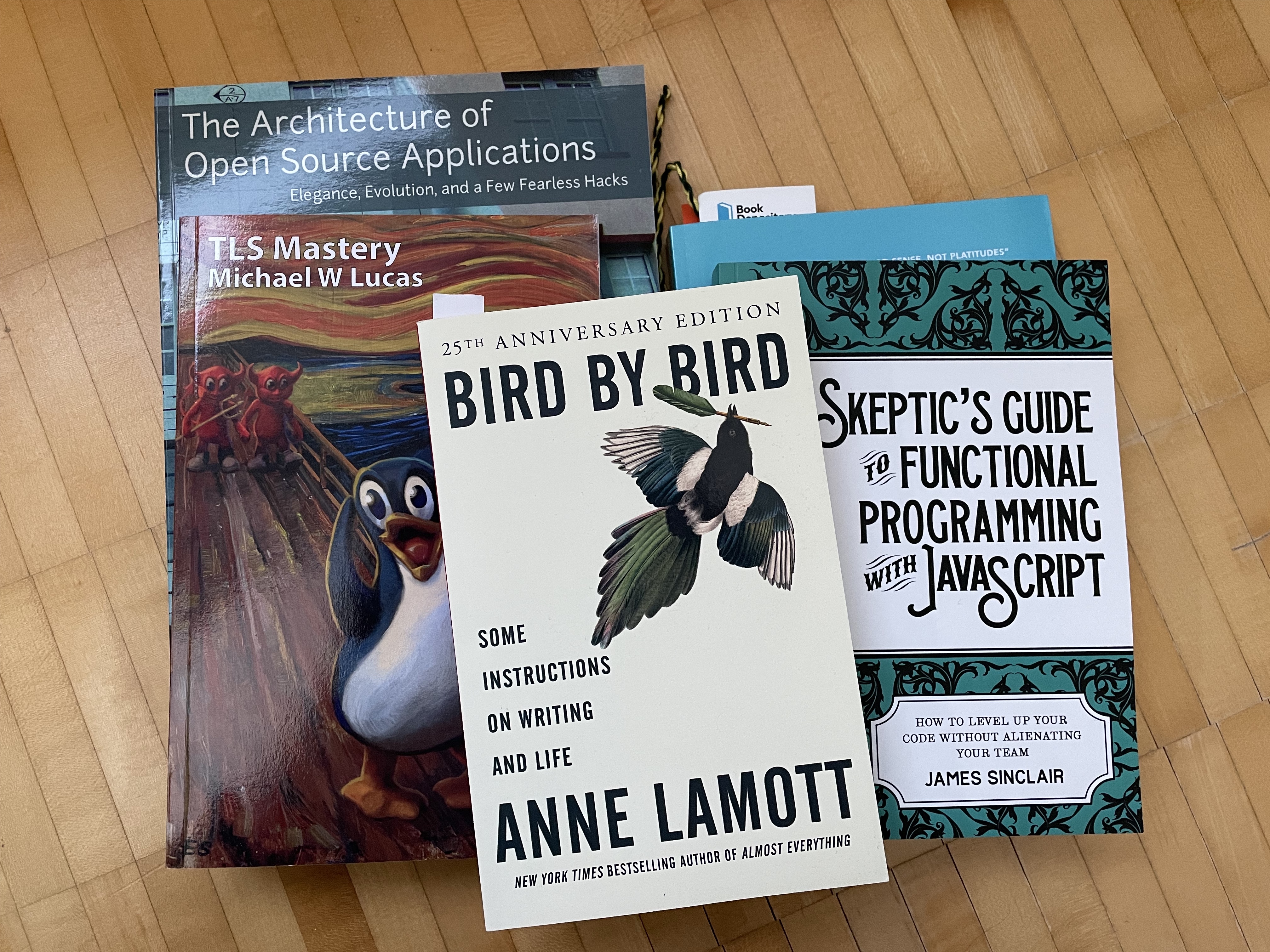 A photo of a stack of non fiction books to be read. Showing Bird by bird on the top and other below it.