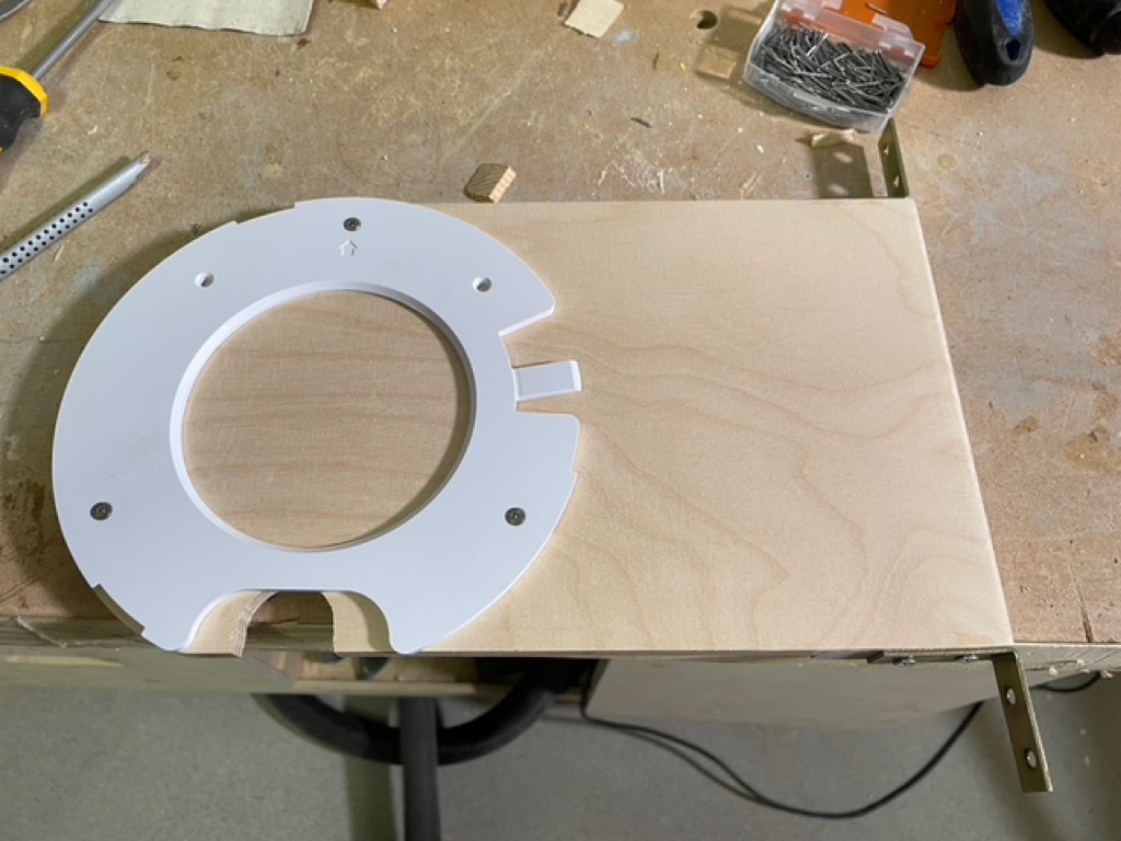 A closeup of fitting the plastic ring to hold the access point.