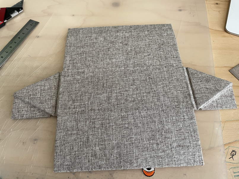 The outer fabric applied (the grey textured one).